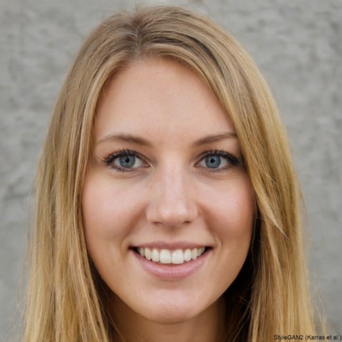 A headshot of a woman in business attire